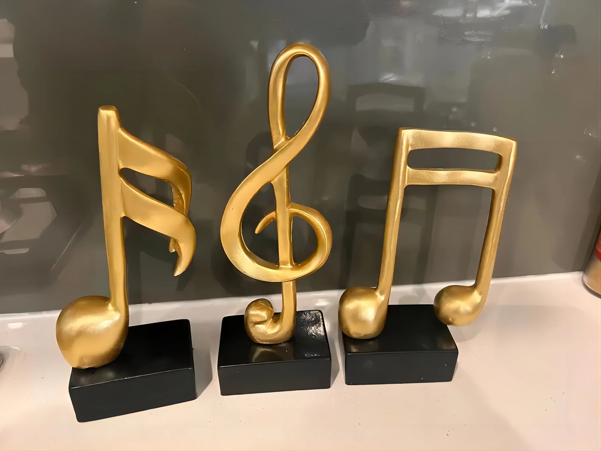 Perfecsy gold metal music note statues 3-piece set on black bases on Tampa Home & Garden Store