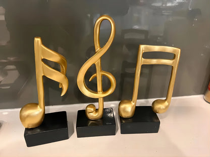Perfecsy gold metal music note statues 3-piece set on black bases on Tampa Home & Garden Store