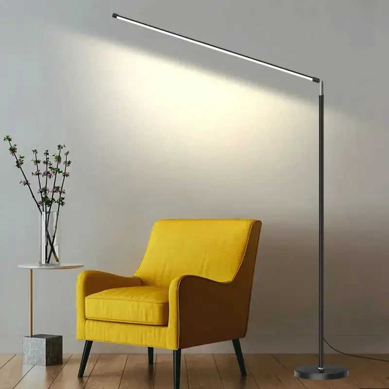 DecorBites LED Floor Lamp, silver metal with a slim horizontal light bar over a yellow armchair on Tampa Home & Garden Store