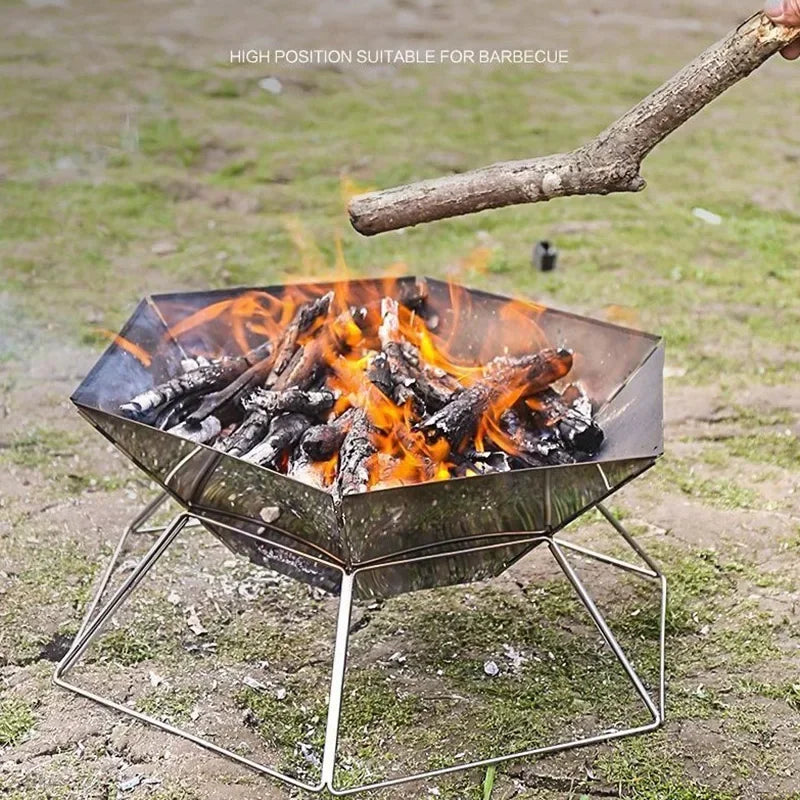 Portable wood stove brazier camping fire pit with folding stainless steel stand and burning logs on Tampa Home & Garden Store