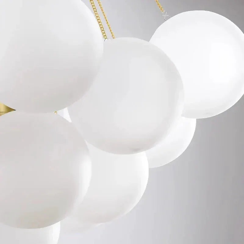 DecorBites LED pendant chandelier cluster of white glass spheres with gold chains on Tampa Home & Garden Store