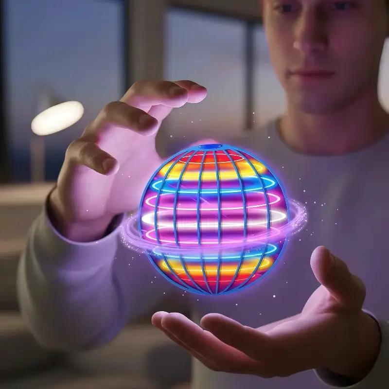 Flying Orb Boomerang Ball LED hover toy with neon rainbow LED and blue grid sphere in hands on Tampa Home & Garden Store