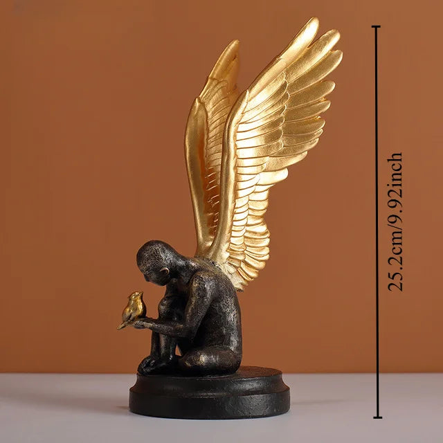 Angel Wings statue by Perfecsy with gold wings atop a dark resin figure, modern decor on Tampa Home & Garden Store