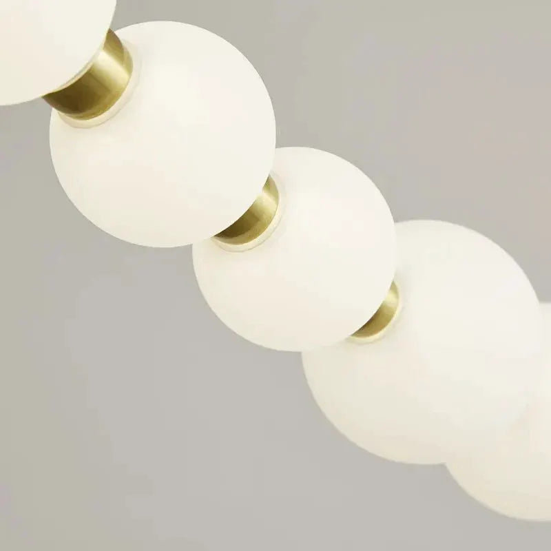 DecorBites LED pendant chandelier four white globe pendants with brass accents on Tampa Home & Garden Store