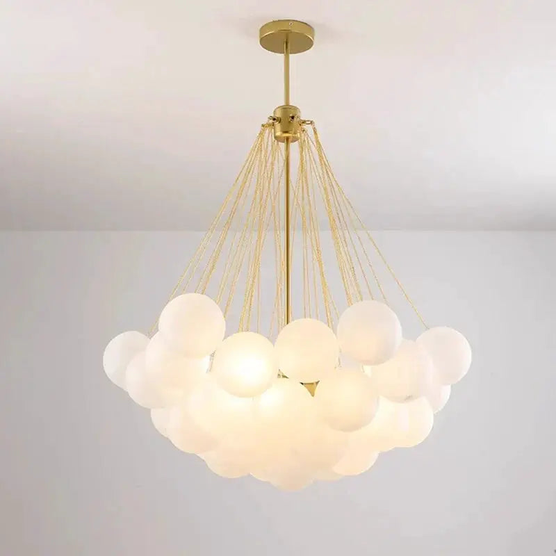 DecorBites LED pendant chandelier with white glass spheres, gold hardware, modern design on Tampa Home & Garden Store