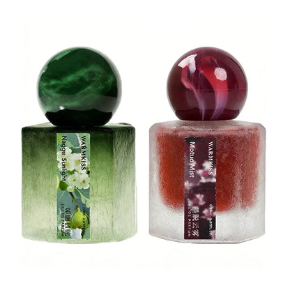 Dual frosted square perfume bottles by Silcy Skin with green and burgundy caps on Tampa Home & Garden Store