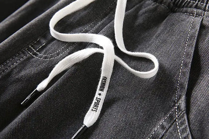 Men's wide-leg jeans in dark denim with white drawstring and metal aglets on Tampa Home & Garden Store