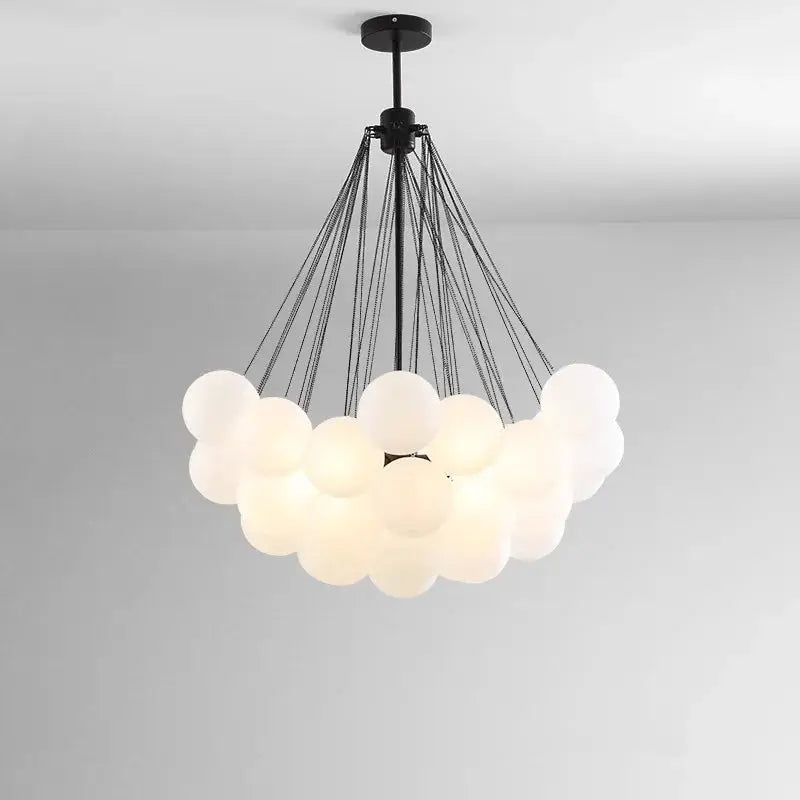 DecorBites LED pendant chandelier with a cloud of white glass globes suspended by black cords on Tampa Home & Garden Store
