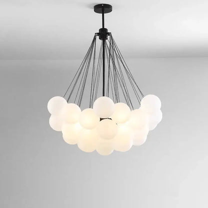 DecorBites LED pendant chandelier with a cloud of white glass globes suspended by black cords on Tampa Home & Garden Store