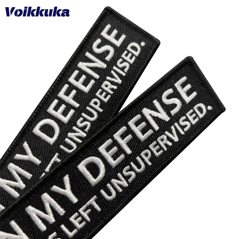 Left Unsupervised Motorcycle Keychain, black fabric patches, 2 patches, Voikkuka on Tampa Home & Garden Store