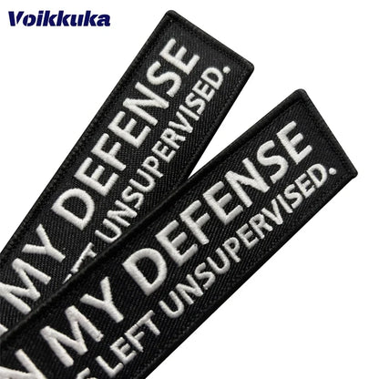 Left Unsupervised Motorcycle Keychain, black fabric patches, 2 patches, Voikkuka on Tampa Home & Garden Store