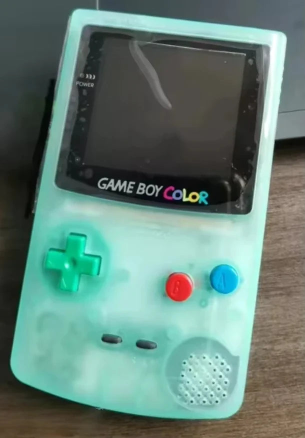 Game Boy Color handheld in turquoise shell with green D-pad, red A, blue B, IPS backlight on Tampa Home & Garden Store