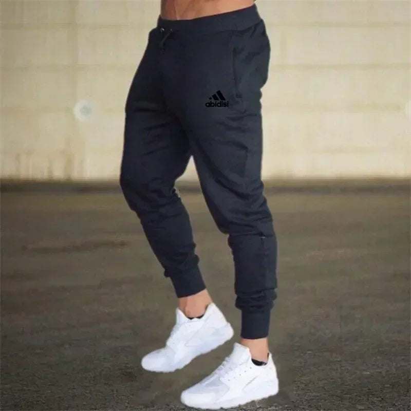 Men jogger pants in black with Adidas logo, tapered cuffs, white sneakers on Tampa Home & Garden Store