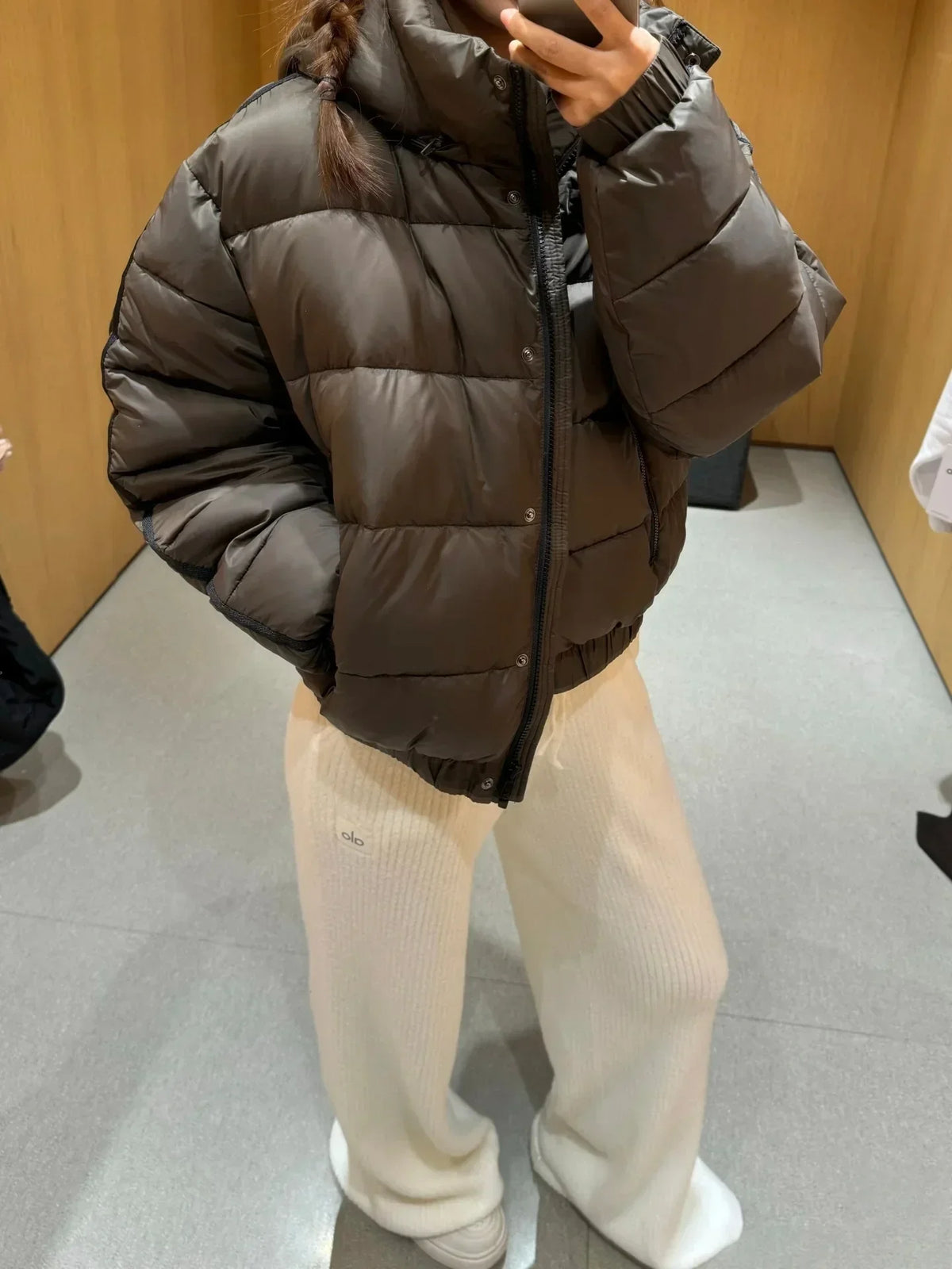 Women’s dark brown hooded puffer jacket with thick quilted panels and front zipper on Tampa Home & Garden Store