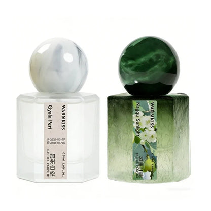 Silcy Skin perfume duo: white frosted bottle with marble cap and green gradient bottle, two bottles on Tampa Home & Garden Store