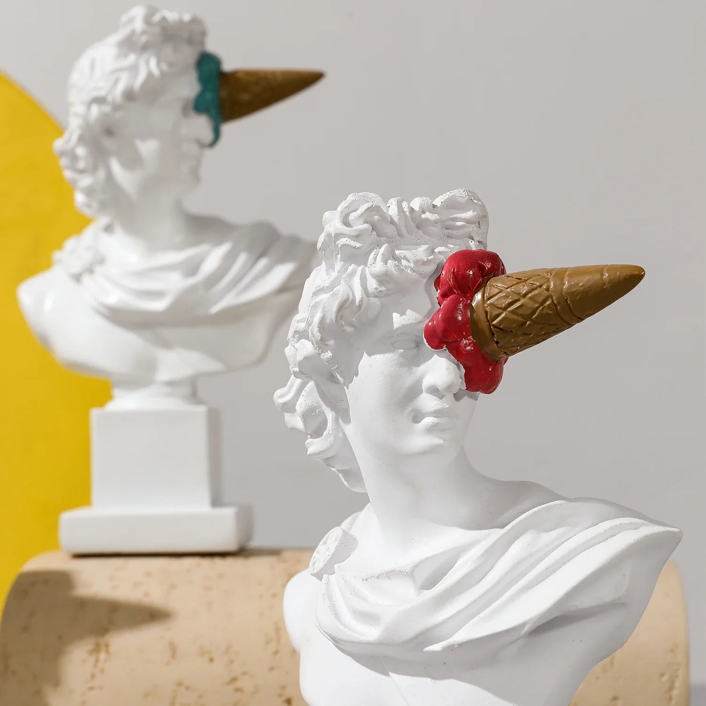 Perfecsy Apollo resin bust with brown ice cream cone and red scoop 2 white statues on Tampa Home & Garden Store