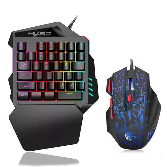 Wired RGB backlit keyboard and blue splatter mouse with palm rest and rainbow keys on Tampa Home & Garden Store