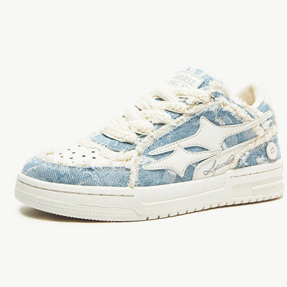 Tennis sneakers in light blue denim with white leather star detail and rope laces on white sole on Tampa Home & Garden Store