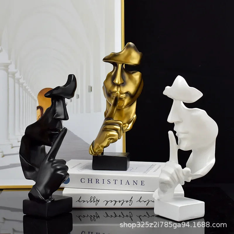 Three resin thinker statues in black, gold and white with finger to lips, Perfecsy decor on Tampa Home & Garden Store