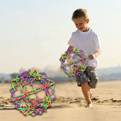 Colorful retractable flower ball toy for indoor outdoor play; child with neon balls on beach on Tampa Home & Garden Store