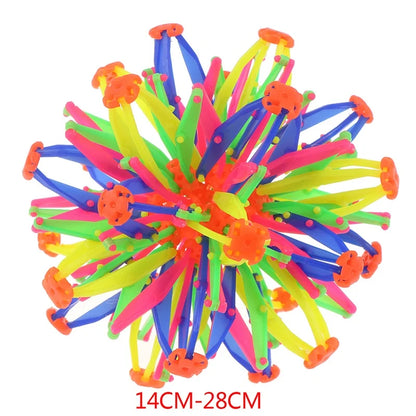 Colorful retractable ball toy with neon strips in a flower-ball design for indoor outdoor play on Tampa Home & Garden Store