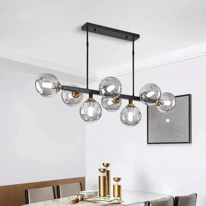 Decorbites LED pendant chandelier with seven globes on a black metal bar with brass accents on Tampa Home & Garden Store
