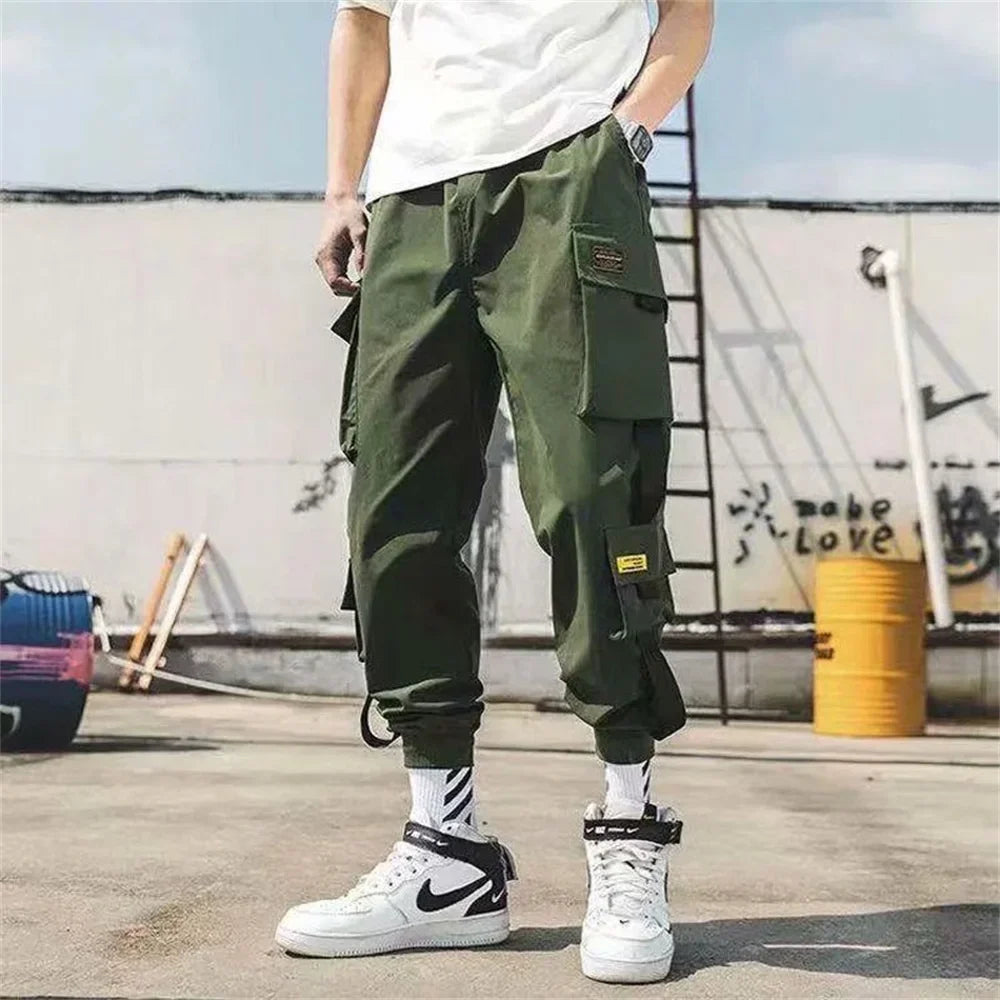 Men's olive green cargo joggers with multiple pockets, tapered elastic cuffs on Tampa Home & Garden Store