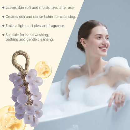 Grape hand soap by Silcy Skin with grape cluster and soap bubbles beside a smiling woman in bath on Tampa Home & Garden Store