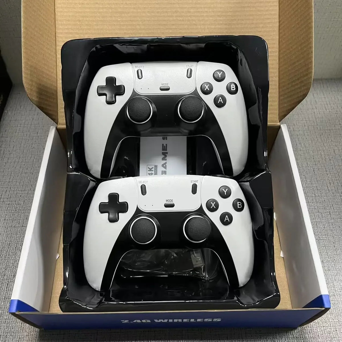 128G Game Stick M15 4K TV game console with wireless gamepads, white and black controllers on Tampa Home & Garden Store