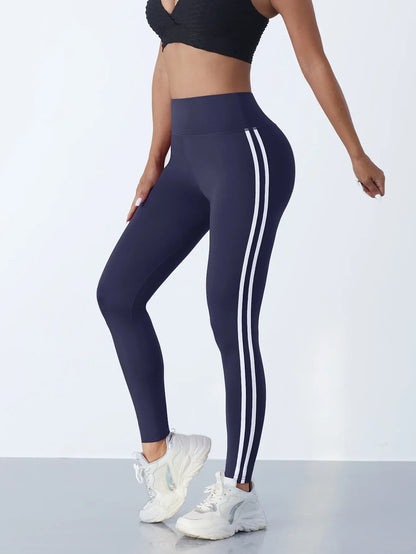 Women's navy striped yoga leggings with double white side stripes, high-waist slim-fit athletic pants on Tampa Home & Garden Store