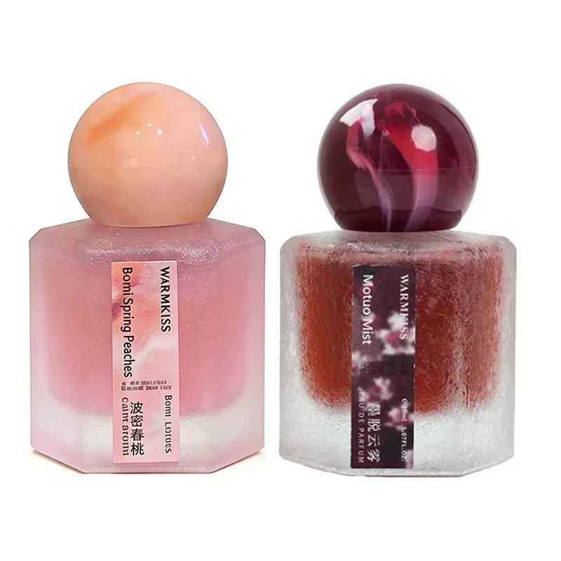 Rose perfume duo by Silcy Skin in pink frosted square bottles with round marbled caps on Tampa Home & Garden Store