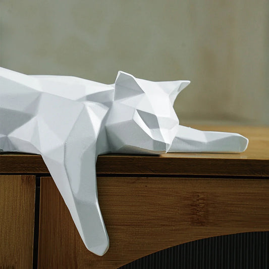 White geometric cat statue lying on a wooden desk, modern home office decor on Tampa Home & Garden Store