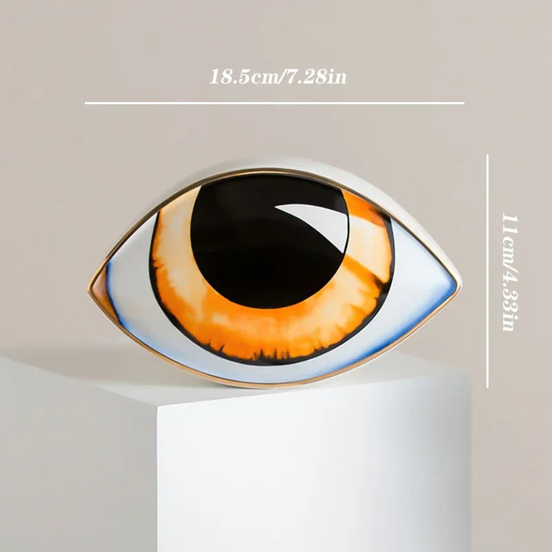 Nordic ceramic devil's-eye eye sculpture by Perfecsy with orange iris and black pupil on Tampa Home & Garden Store