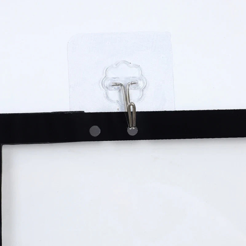 Mini basketball hoop backboard with metal mounting hook on a black door strip mount on Tampa Home & Garden Store