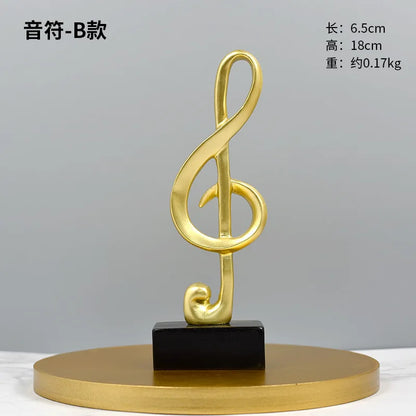 Golden treble clef music note statue on black square pedestal atop a round gold platform on Tampa Home & Garden Store