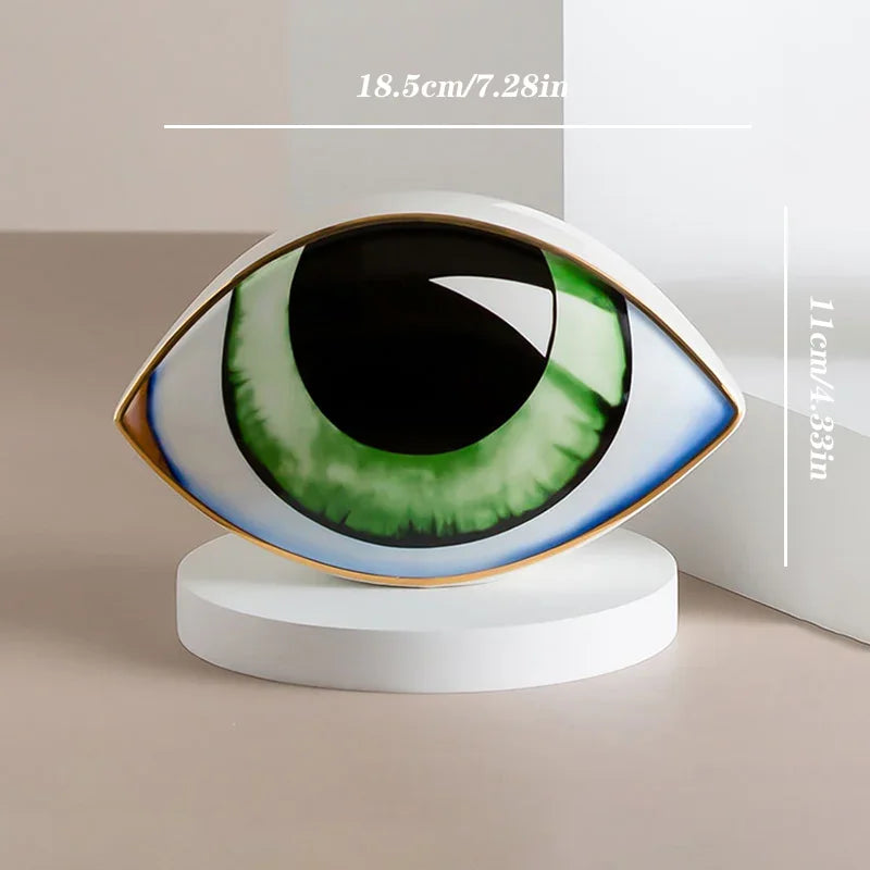 Perfecsy Nordic style ceramic eye sculpture with green iris on white pedestal on Tampa Home & Garden Store