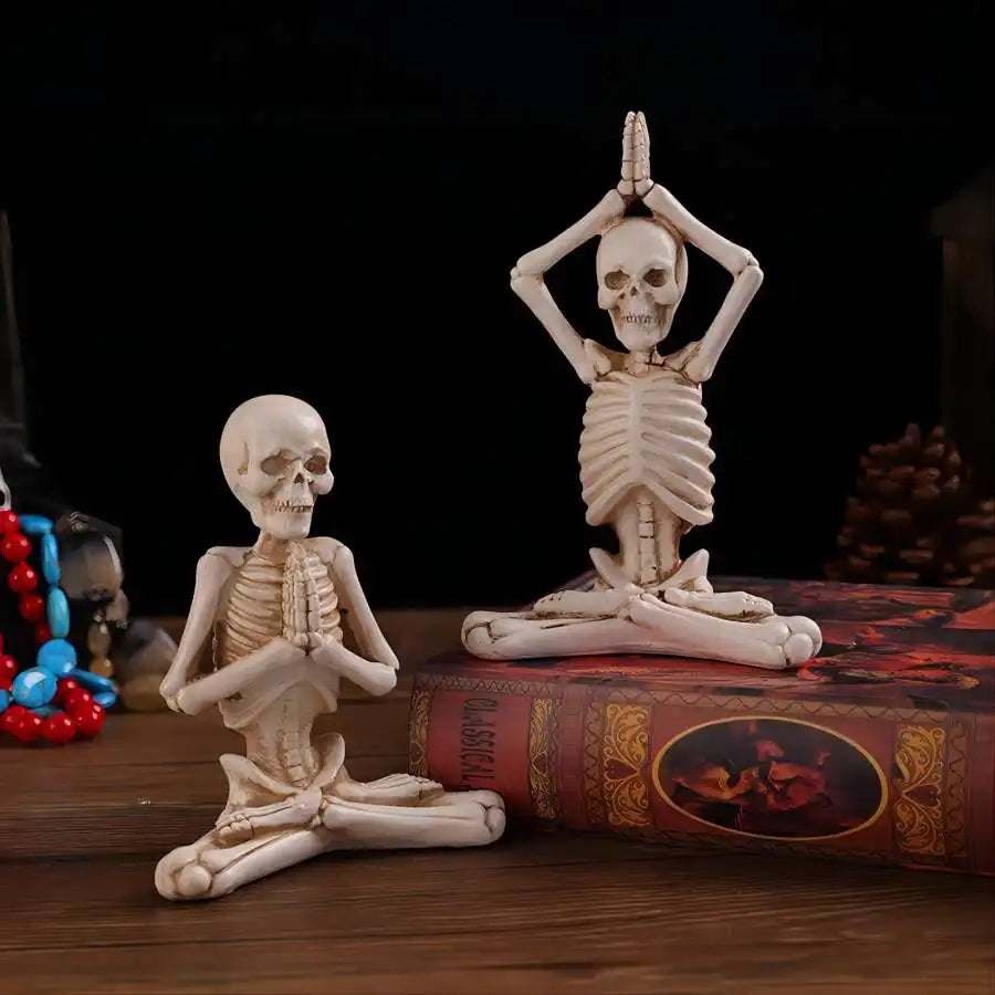 Set of 2 resin meditation skeleton statues in yoga and prayer poses on a book, gothic decor on Tampa Home & Garden Store
