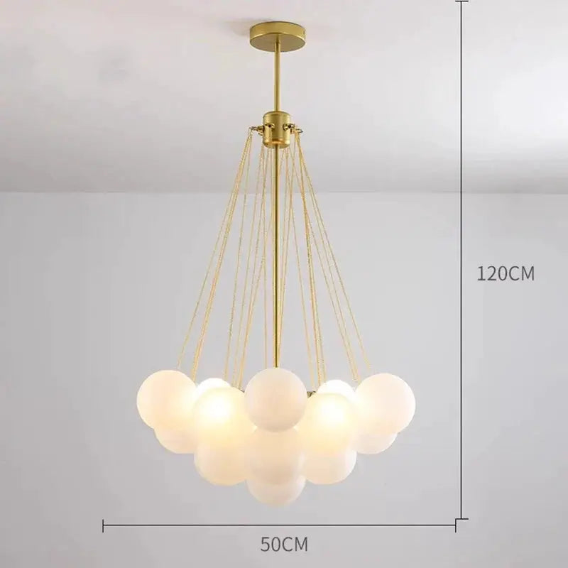DecorBites LED pendant chandelier with brass finish and a cloud of white glass globe lights on Tampa Home & Garden Store