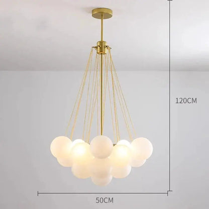 DecorBites LED pendant chandelier with brass finish and a cloud of white glass globe lights on Tampa Home & Garden Store
