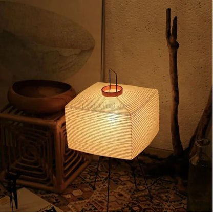 Perfecsy Japanese Creative Tripod Floor Lamp with Wabi-sabi rice paper shade in warm glow on Tampa Home & Garden Store