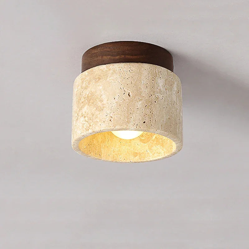 Yellow marble cylindrical ceiling light with warm glow and dark wood mount on Tampa Home & Garden Store