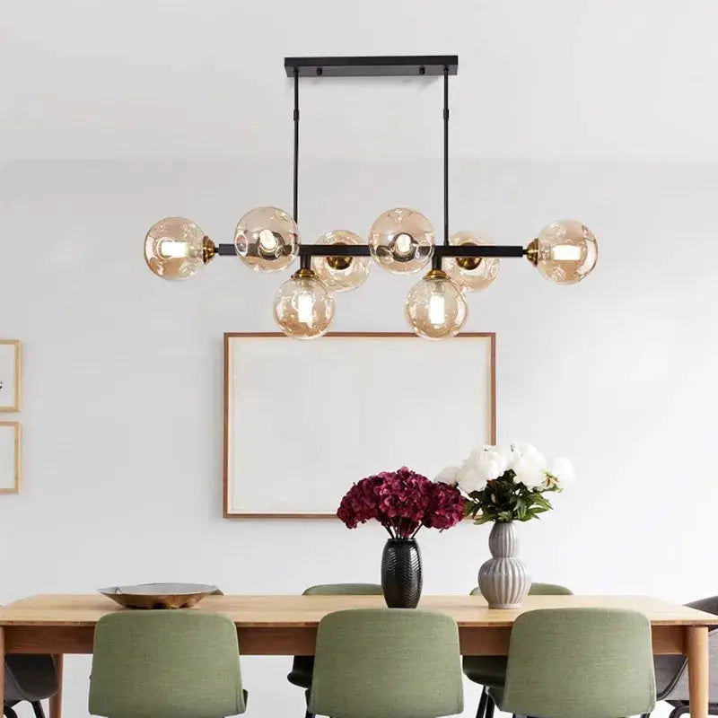 DecorBites LED pendant chandelier with black metal frame and amber glass globes over a dining table on Tampa Home & Garden Store