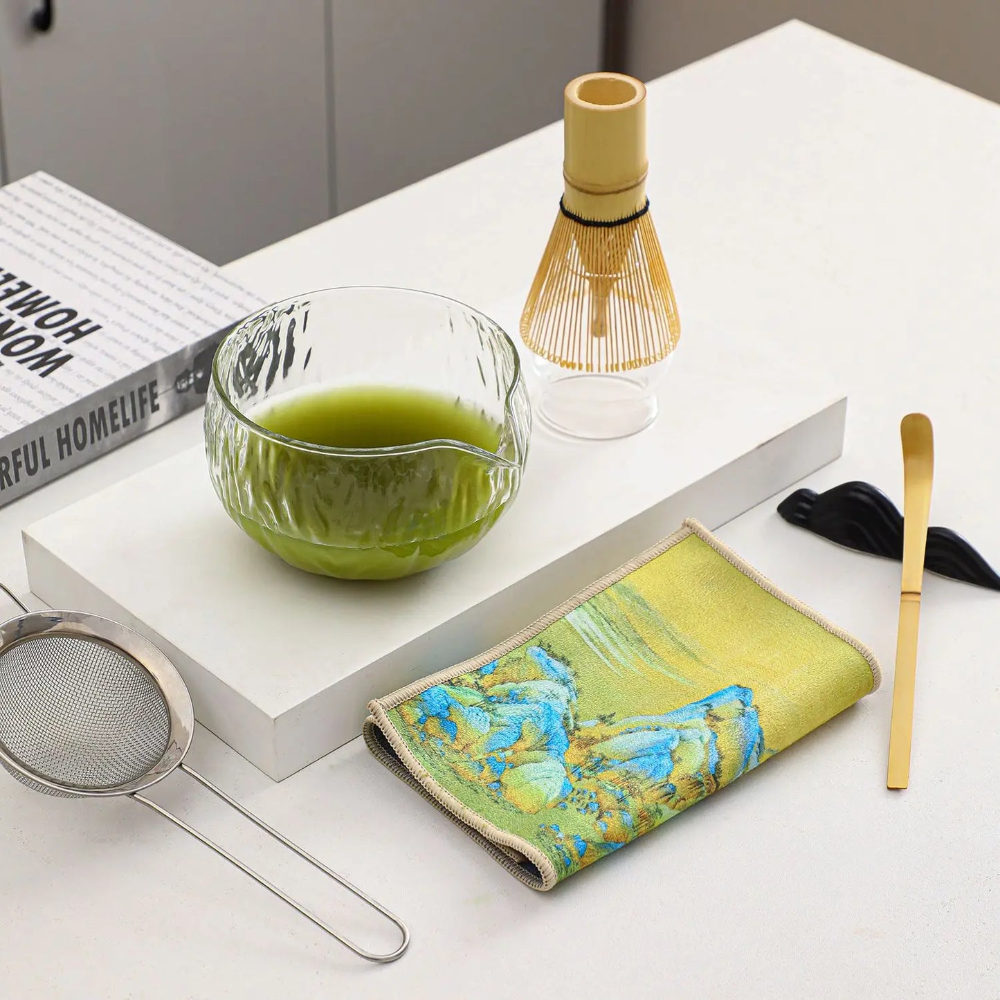 Perfecsy glass matcha whisk set with bamboo chasen and holder beside a green matcha bowl on Tampa Home & Garden Store