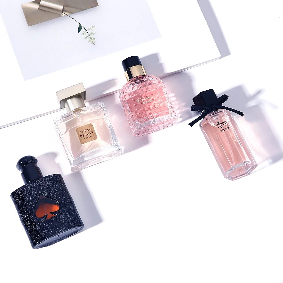 Original Women's Perfume 4-piece set with floral scents; pink diamond, navy glitter bottles on Tampa Home & Garden Store
