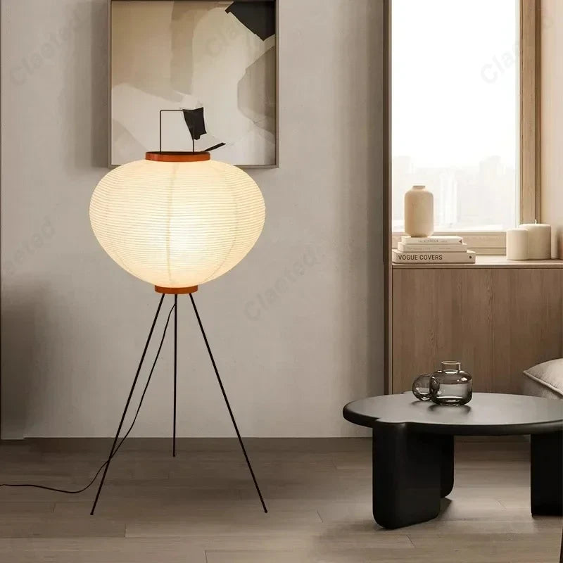 Creative Atmosphere LED Rice Paper Floor Lamp with spherical shade and black tripod legs on Tampa Home & Garden Store