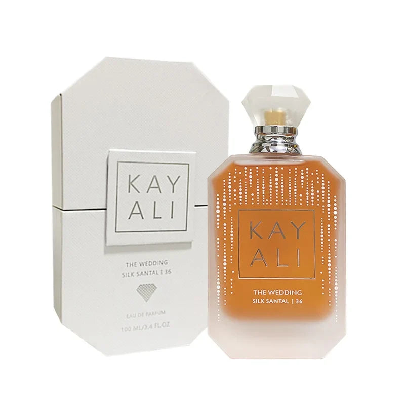 Kayali EDP perfume bottle with peach gradient glass and diamond-cap beside white box on Tampa Home & Garden Store