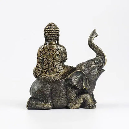 Elephant Buddha resin statue with antique bronze finish and floral robe, sitting Buddha on elephant back on Tampa Home & Garden Store