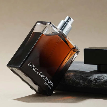 Dolce & Gabbana The One men perfume bottle with amber liquid, silver spray, black cap on Tampa Home & Garden Store