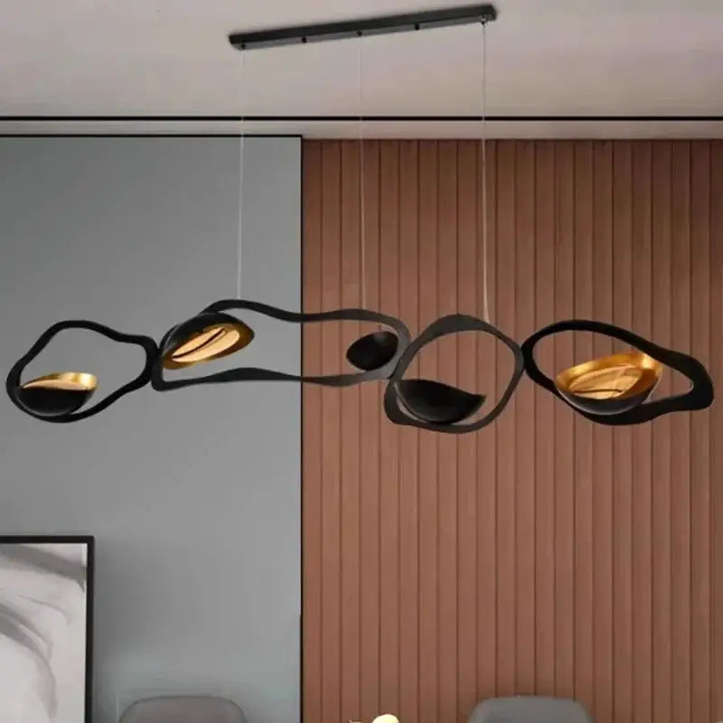 DecorBites LED pendant chandelier with black looping rings and warm amber interior lights on Tampa Home & Garden Store