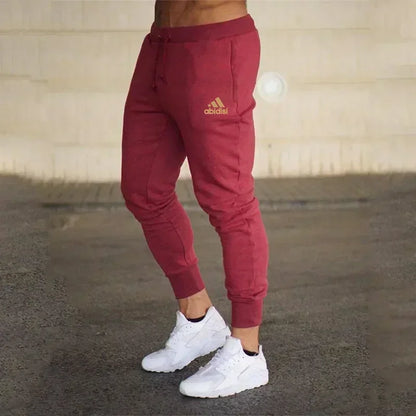 Adidas maroon men's joggers with drawstring waist and tapered cuffs on Tampa Home & Garden Store